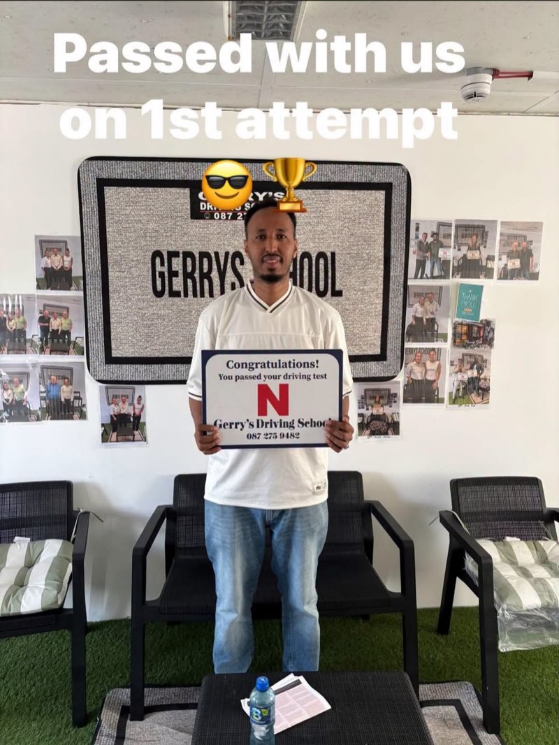 Abdi celebrating his driving test pass with Gerry