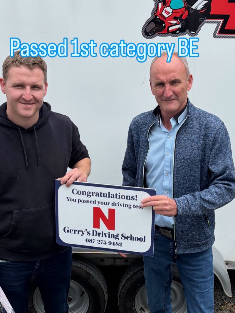Cian celebrating his BE test pass with Gerry