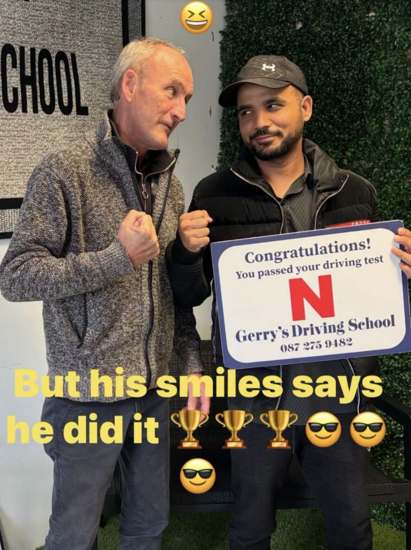 A learner celebrating his first-time driving test pass with Gerry